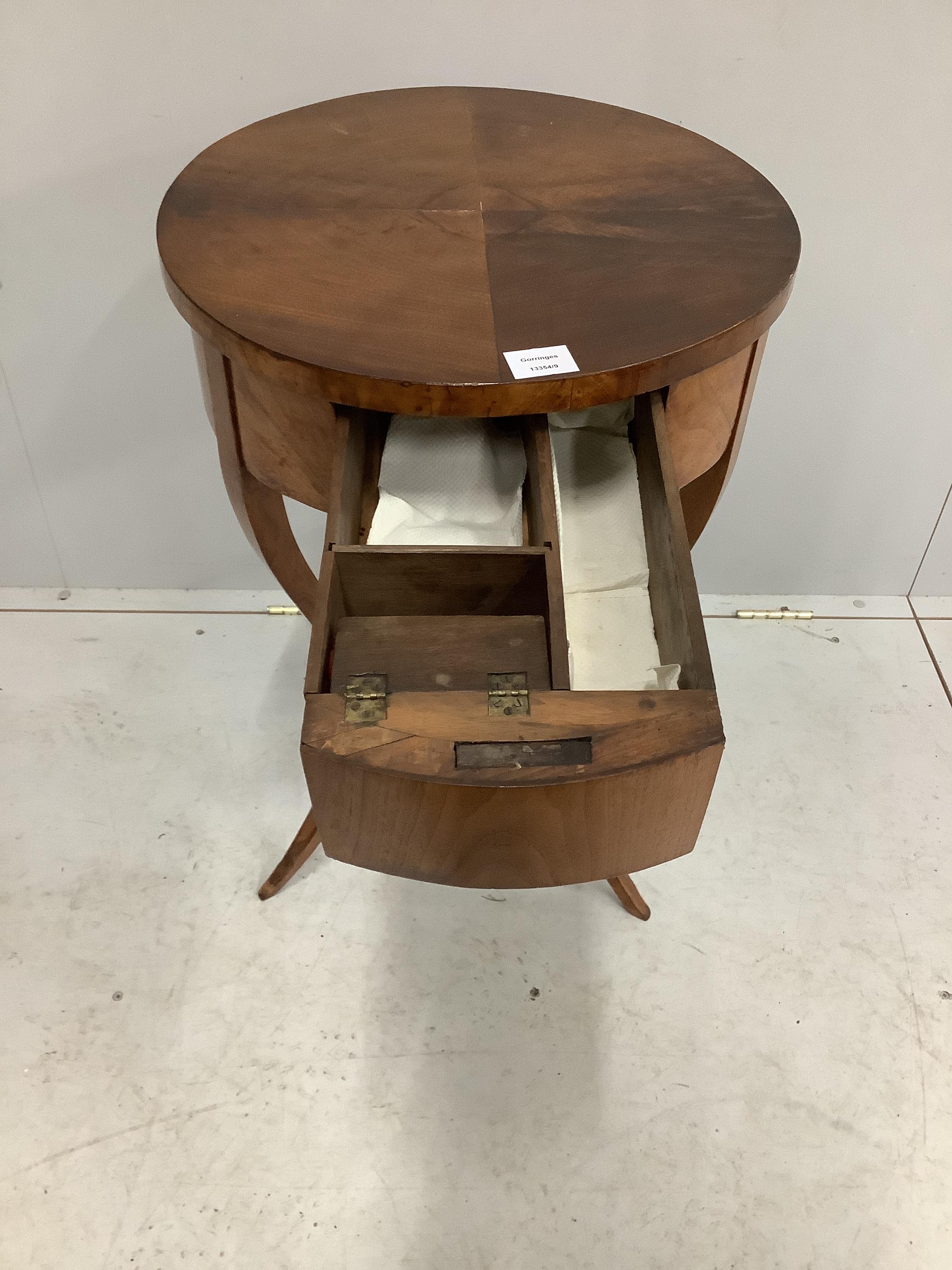 A 19th century Biedermeier mahogany circular work table, diameter 46cm, height 75cm